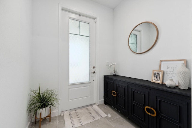 foyer featuring light tile patterned floors