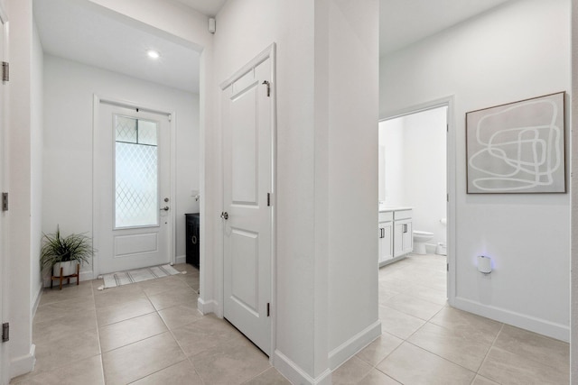 foyer entrance featuring light tile patterned floors