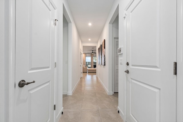 corridor with light tile patterned floors