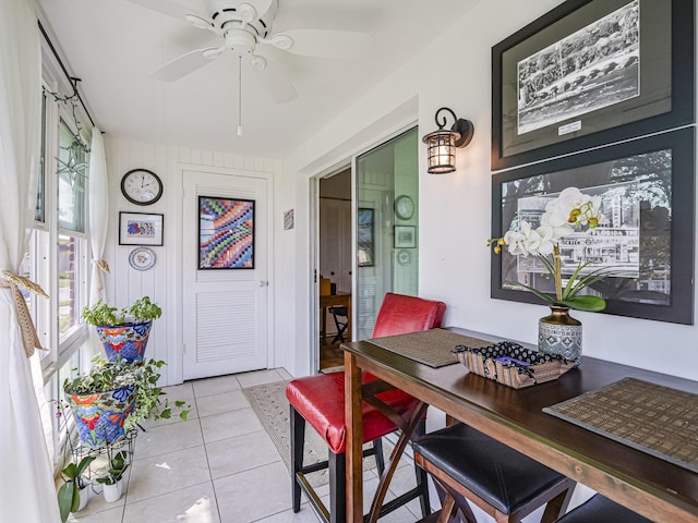 tiled dining area with ceiling fan