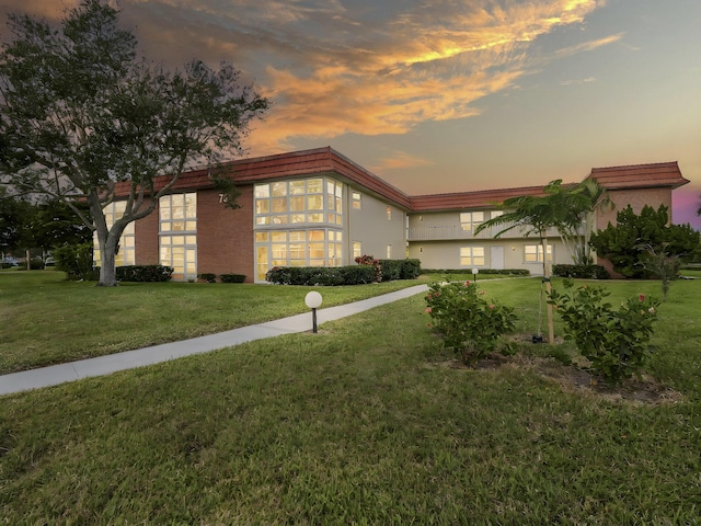 view of outdoor building at dusk