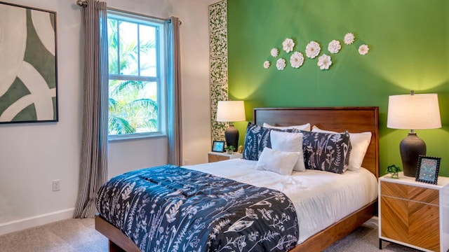 bedroom featuring carpet and multiple windows