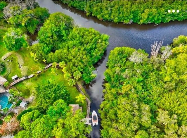 birds eye view of property featuring a water view