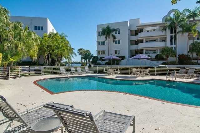 view of swimming pool featuring a patio area