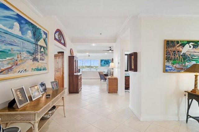 hall featuring crown molding and light tile patterned flooring