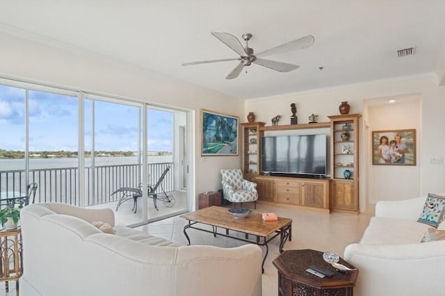 living room featuring ornamental molding, a water view, and ceiling fan