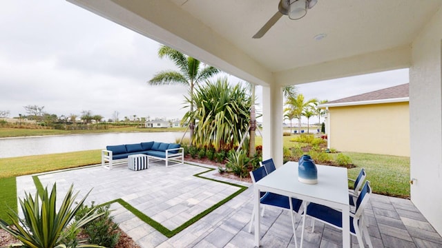 view of patio / terrace with a water view, an outdoor hangout area, and ceiling fan