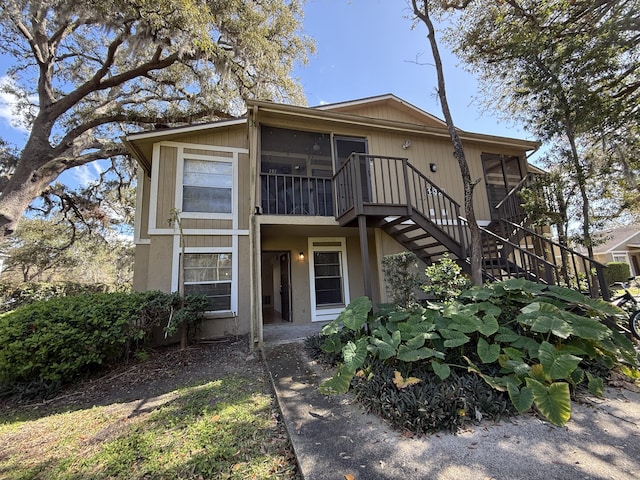 view of front of property with a sunroom