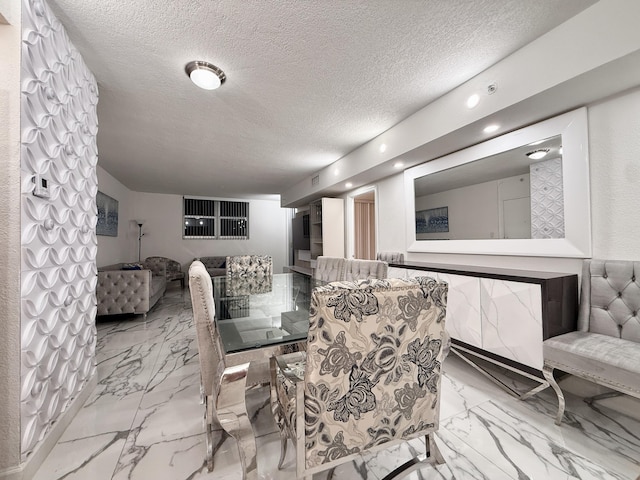 dining room with a textured ceiling, recessed lighting, and marble finish floor