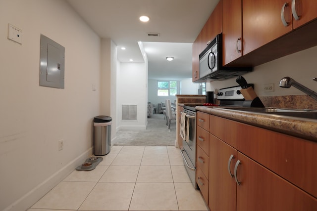 kitchen with electric panel, sink, stainless steel electric range, and light tile patterned floors