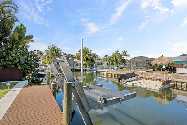 401 Center St, Jupiter, FL 33458 - dock featuring boat lift and a water view