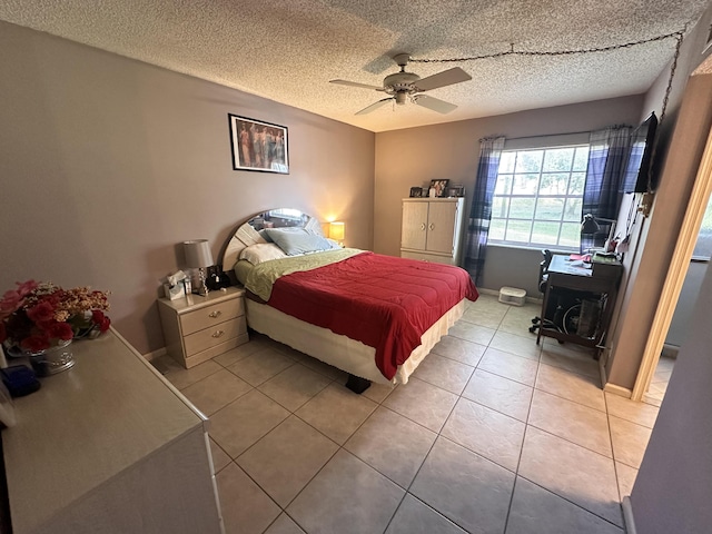 tiled bedroom featuring a textured ceiling and ceiling fan