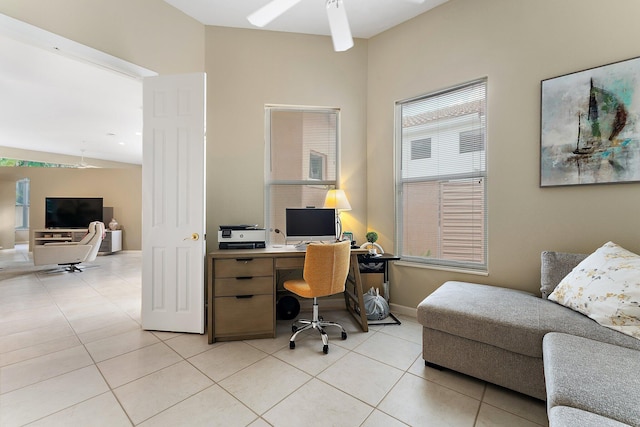 office with light tile patterned floors and ceiling fan