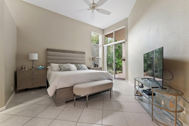 bedroom with ceiling fan, access to outside, and light tile patterned floors