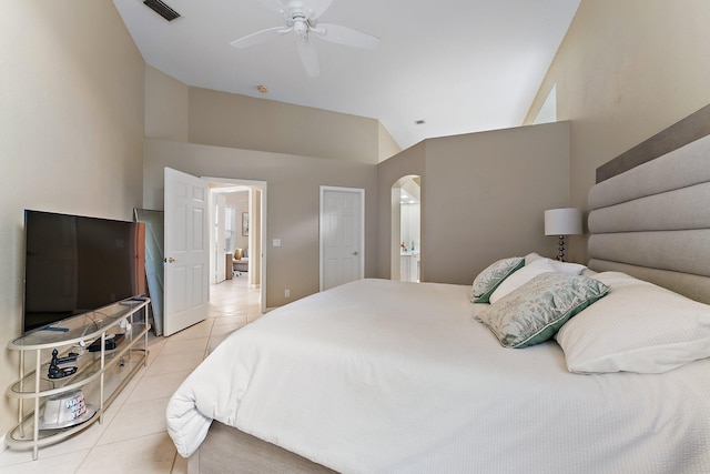 bedroom featuring ceiling fan, lofted ceiling, and light tile patterned floors