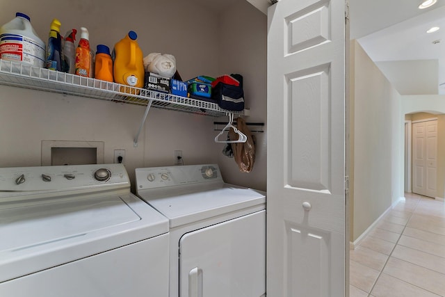 washroom with light tile patterned flooring and independent washer and dryer