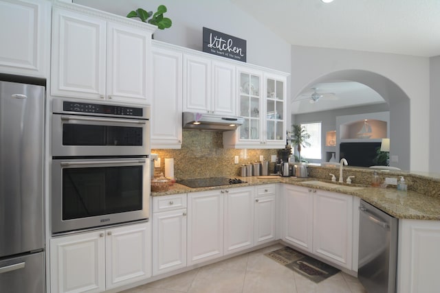 kitchen with appliances with stainless steel finishes, sink, and white cabinets