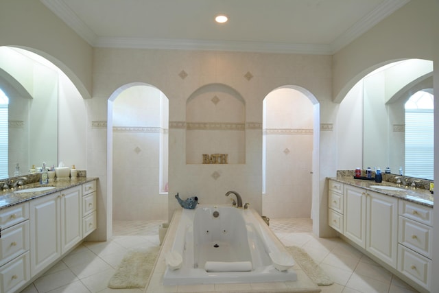 bathroom featuring vanity, tiled bath, crown molding, and tile walls