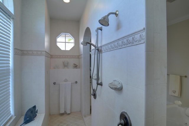 bathroom featuring tile patterned flooring and shower with separate bathtub