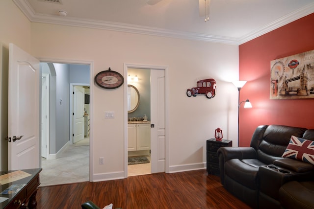 living room with hardwood / wood-style flooring and ornamental molding