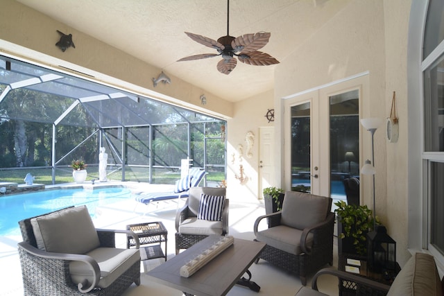 view of patio / terrace with ceiling fan and a lanai