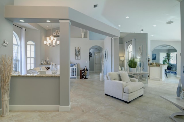 living room with a notable chandelier and a healthy amount of sunlight