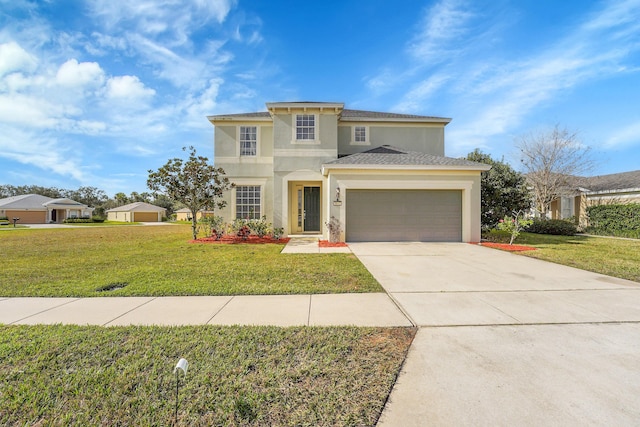 mediterranean / spanish home featuring a garage and a front yard