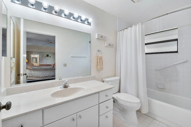 full bathroom featuring shower / bath combo, vanity, tile patterned floors, and toilet