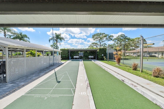 view of community with tennis court