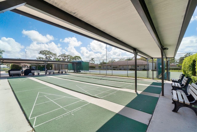 surrounding community with tennis court