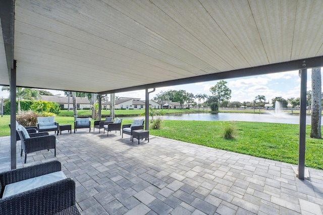 view of patio featuring outdoor lounge area and a water view