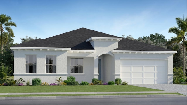 view of front of home featuring a garage and a front yard