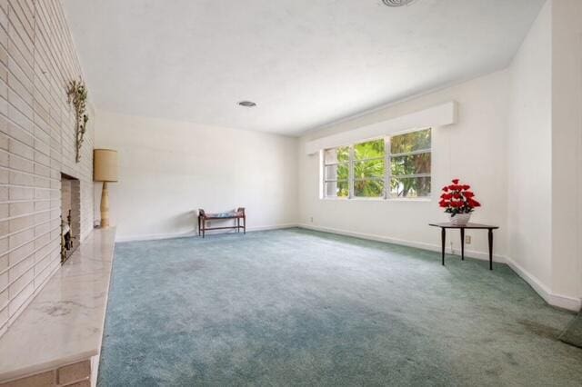 1531 Bacom Point Rd, Pahokee, FL 33476 - spare room with carpet and a fireplace
