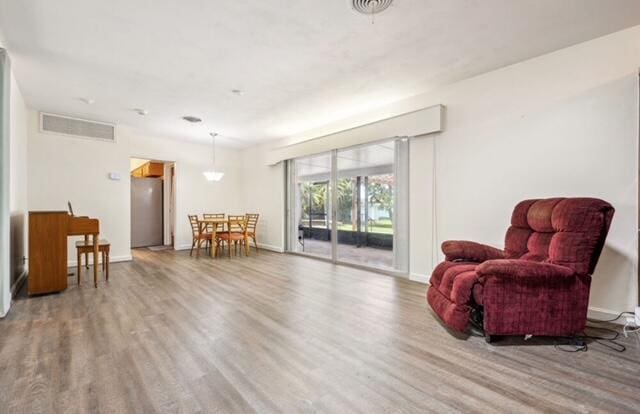 1531 Bacom Point Rd, Pahokee, FL 33476 - living area featuring wood finished floors and baseboards