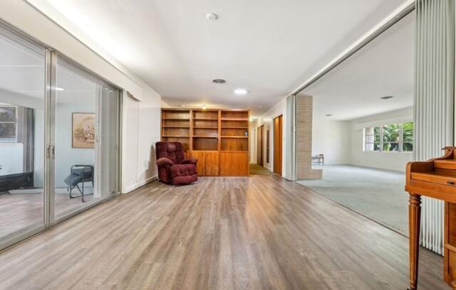 1531 Bacom Point Rd, Pahokee, FL 33476 - living area with wood finished floors and built in shelves