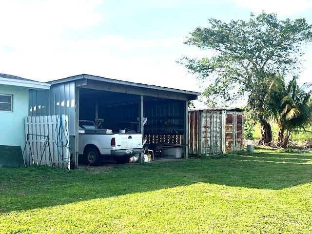 1531 Bacom Point Rd, Pahokee, FL 33476 - view of outbuilding featuring a carport