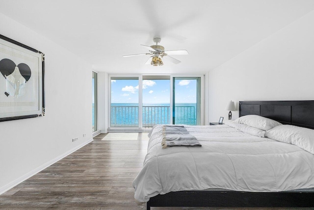 3211 S Ocean Blvd Unit 802, Highland Beach, FL 33487 - bedroom with access to exterior, wood finished floors, a water view, ceiling fan, and expansive windows