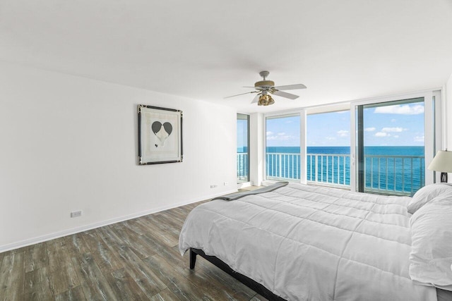 3211 S Ocean Blvd Unit 802, Highland Beach, FL 33487 - bedroom featuring dark wood-style flooring, a water view, floor to ceiling windows, access to exterior, and baseboards