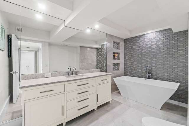 3211 S Ocean Blvd Unit 802, Highland Beach, FL 33487 - full bath featuring a freestanding tub, vanity, tile walls, and marble finish floors