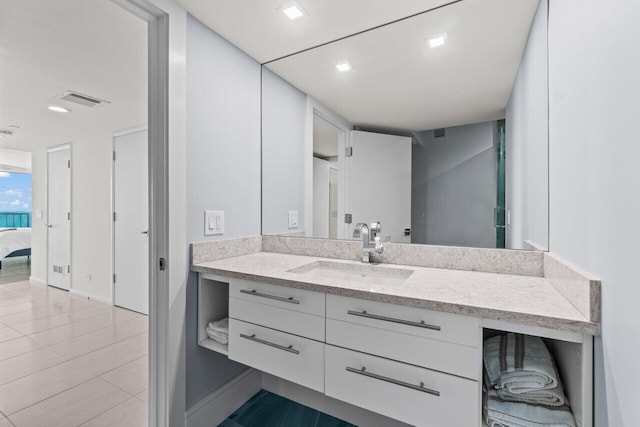 3211 S Ocean Blvd Unit 802, Highland Beach, FL 33487 - bathroom featuring vanity, baseboards, tile patterned floors, and ensuite bathroom