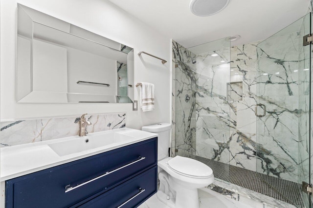3211 S Ocean Blvd Unit 802, Highland Beach, FL 33487 - bathroom featuring toilet, a marble finish shower, vanity, backsplash, and marble finish floors