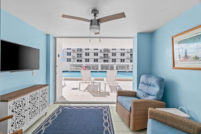 3211 S Ocean Blvd Unit 802, Highland Beach, FL 33487 - sitting room featuring ceiling fan and tile patterned floors
