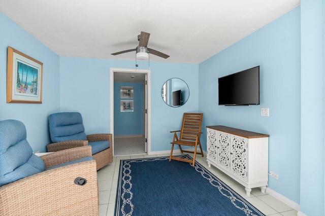 3211 S Ocean Blvd Unit 802, Highland Beach, FL 33487 - sitting room featuring ceiling fan, tile patterned flooring, and baseboards