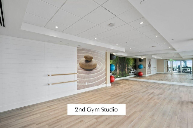 3211 S Ocean Blvd Unit 802, Highland Beach, FL 33487 - workout room featuring wood finished floors and a drop ceiling
