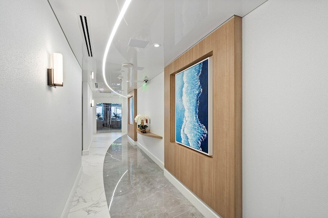 3211 S Ocean Blvd Unit 802, Highland Beach, FL 33487 - hall with light marble finish floors, baseboards, and recessed lighting