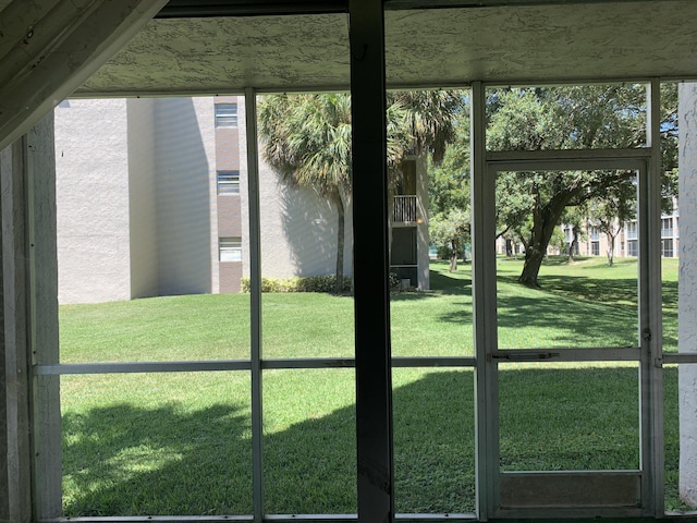 doorway to outside featuring a healthy amount of sunlight