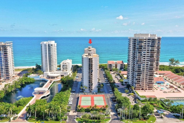 birds eye view of property with a water view