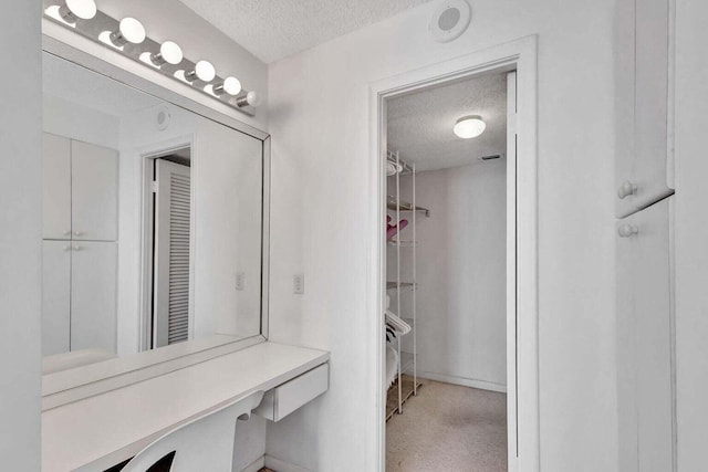 bathroom featuring a textured ceiling