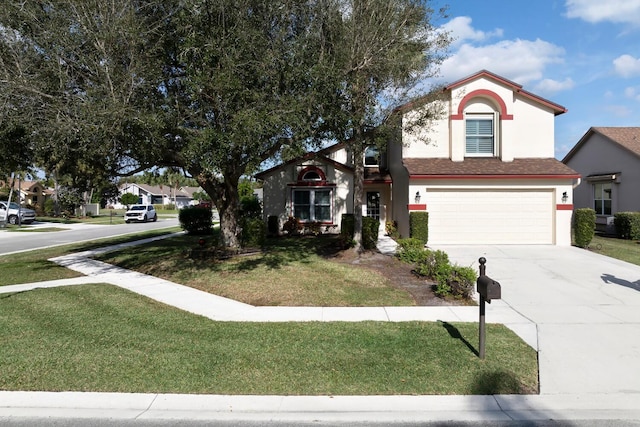 view of front of property featuring a garage and a front yard