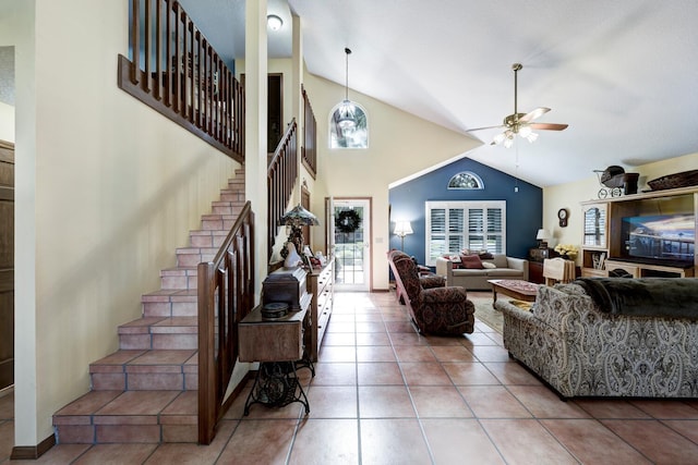 living room featuring vaulted ceiling, tile patterned floors, and ceiling fan